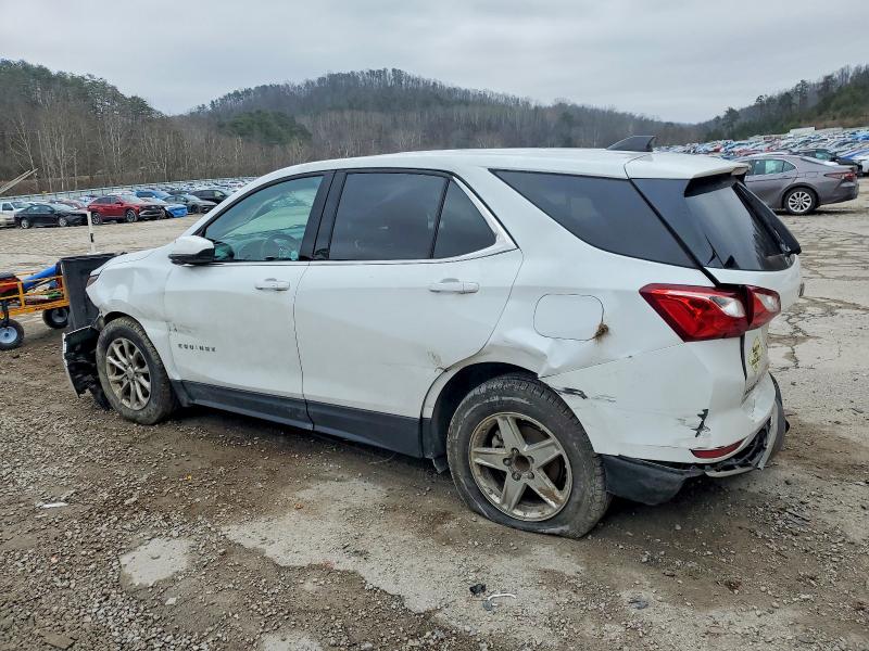 White Chevrolet Equinox with rear-side collision damage at a salvage yard